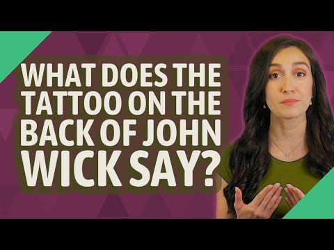 What does the tattoo on the back of John Wick say?